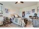 Bright bedroom features a comfortable bed, stylish decor, and functional workspace at 16546 Umatilla Place, Broomfield, CO 80023