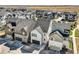 Charming exterior view featuring modern townhomes with unique architectural details and private driveways at 16546 Umatilla Place, Broomfield, CO 80023