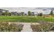 Beautifully landscaped green space with a walking path and neighborhood homes at 16546 Umatilla Place, Broomfield, CO 80023