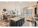 Spacious kitchen featuring a granite island with seating and an open floorplan at 16546 Umatilla Place, Broomfield, CO 80023