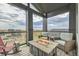 Outdoor patio with fire table and scenic views of the neighborhood at 16546 Umatilla Place, Broomfield, CO 80023