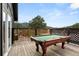 Deck features an outdoor pool table with mountain views at 3046 S Alpine Dr, Evergreen, CO 80439