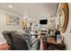 Spacious living room featuring hardwood floors and comfortable seating at 3046 S Alpine Dr, Evergreen, CO 80439