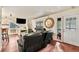 Comfortable living room with hardwood floors and access to outdoor space at 3046 S Alpine Dr, Evergreen, CO 80439
