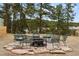 Outdoor seating area with a firepit perfect for entertaining guests at 3046 S Alpine Dr, Evergreen, CO 80439