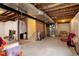 Unfinished basement providing ample potential for customization and storage at 5563 S Elk Ct, Aurora, CO 80016