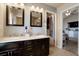 Spacious double vanity bathroom, well lit, with attached access to the bedroom at 5563 S Elk Ct, Aurora, CO 80016