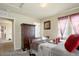 Charming bedroom featuring carpet floors and a large wardrobe at 5563 S Elk Ct, Aurora, CO 80016