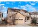 Lovely home exterior with a charming front porch and solar panels on the roof at 5563 S Elk Ct, Aurora, CO 80016