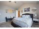 Comfortable bedroom with vaulted ceilings and an open ensuite bathroom at 5563 S Elk Ct, Aurora, CO 80016