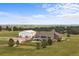 Aerial view of the home, outbuilding, and property showcasing the spacious yard and scenic surroundings at 6785 Arrowhead Cir, Elizabeth, CO 80107