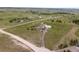 Expansive aerial view of a house and its large, well-maintained acreage, offering privacy and a rural lifestyle at 6785 Arrowhead Cir, Elizabeth, CO 80107