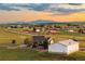 A view of the home and the surrounding area, with rolling fields and a picturesque mountain range in the distance at 6785 Arrowhead Cir, Elizabeth, CO 80107