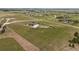 Aerial view of the property showing a large home, outbuildings and vast greenery at 6785 Arrowhead Cir, Elizabeth, CO 80107