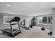 Basement gym with treadmill, exercise bike, and free weights at 6785 Arrowhead Cir, Elizabeth, CO 80107