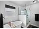 Modern bathroom featuring a freestanding tub and a glass-enclosed shower at 6785 Arrowhead Cir, Elizabeth, CO 80107