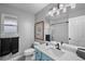 Renovated bathroom with a blue vanity and a subway tile shower at 6785 Arrowhead Cir, Elizabeth, CO 80107