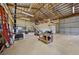 Spacious garage with high ceilings and ample storage space, ideal for hobbies, projects, or vehicle storage at 6785 Arrowhead Cir, Elizabeth, CO 80107