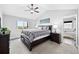 Comfortable main bedroom with a king-sized bed and an en-suite bathroom with a soaking tub at 6785 Arrowhead Cir, Elizabeth, CO 80107