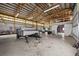 Interior of a spacious outbuilding featuring a concrete floor and a trailer inside at 6785 Arrowhead Cir, Elizabeth, CO 80107