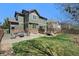 Spacious backyard with a patio, a fire pit, a lush lawn, ideal for outdoor entertaining at 24702 E Hoover Pl, Aurora, CO 80016