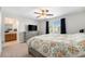 Comfortable bedroom with large windows, soft lighting, and a bathroom ensuite at 24702 E Hoover Pl, Aurora, CO 80016