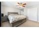 Comfortable bedroom featuring a ceiling fan, large window, and closet at 24702 E Hoover Pl, Aurora, CO 80016