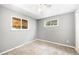 Comfortable bedroom featuring neutral walls, carpet flooring, a ceiling fan, and natural light from windows at 12154 E Virginia Dr, Aurora, CO 80012