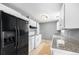Functional kitchen with white cabinets, appliances, and granite countertops, adjacent to the dining room at 12154 E Virginia Dr, Aurora, CO 80012