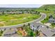 Aerial view of a lovely home showcasing landscaping and a nearby golf course at 2314 Fairway Wood Cir, Castle Rock, CO 80109