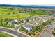 Scenic aerial view of a residential area and golf course with lush greenery and mountain views at 2314 Fairway Wood Cir, Castle Rock, CO 80109