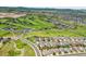 Panoramic aerial view of a neighborhood near a golf course, mountains and recreational amenities at 2314 Fairway Wood Cir, Castle Rock, CO 80109