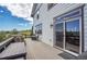 Back deck with outdoor seating, dining set, and sliding glass doors to the home's interior at 2314 Fairway Wood Cir, Castle Rock, CO 80109