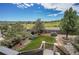 Scenic backyard featuring lush greenery, mature trees, and a beautiful garden area at 2314 Fairway Wood Cir, Castle Rock, CO 80109