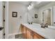 Double vanity bathroom with a large mirror and plenty of counter space at 2314 Fairway Wood Cir, Castle Rock, CO 80109