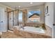 Spa-like bathroom featuring a large soaking tub and walk-in shower at 2314 Fairway Wood Cir, Castle Rock, CO 80109