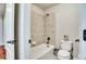 Cozy bathroom featuring a tiled shower-tub combo and a classic white toilet at 2314 Fairway Wood Cir, Castle Rock, CO 80109