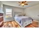 Bedroom with hardwood floors, a ceiling fan, and a view at 2314 Fairway Wood Cir, Castle Rock, CO 80109