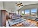 Bright bedroom featuring a vaulted ceiling, hardwood floors, and large windows with scenic views at 2314 Fairway Wood Cir, Castle Rock, CO 80109