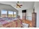 Main bedroom with vaulted ceiling, wood floors, and a view at 2314 Fairway Wood Cir, Castle Rock, CO 80109