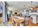 Spacious dining area with a large wooden table, offering views of the living room and kitchen at 2314 Fairway Wood Cir, Castle Rock, CO 80109