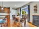 Bright dining area with hardwood floors, a wooden dining table, and large sliding glass doors at 2314 Fairway Wood Cir, Castle Rock, CO 80109