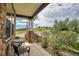 Inviting front porch with comfortable seating and views of the surrounding landscape at 2314 Fairway Wood Cir, Castle Rock, CO 80109