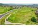 Picturesque aerial view showcasing the well-maintained golf course with players and winding cart paths at 2314 Fairway Wood Cir, Castle Rock, CO 80109