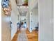 Inviting front hallway featuring gleaming hardwood floors and a view into the light-filled living room at 2314 Fairway Wood Cir, Castle Rock, CO 80109