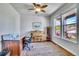 Charming home office features hardwood floors, built-in shelving, and a large window at 2314 Fairway Wood Cir, Castle Rock, CO 80109