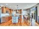 Open-concept kitchen and dining area with hardwood floors and abundant natural light at 2314 Fairway Wood Cir, Castle Rock, CO 80109
