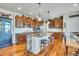 Gourmet kitchen featuring custom cabinetry, granite countertops, and modern appliances at 2314 Fairway Wood Cir, Castle Rock, CO 80109