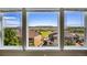 Triple window view of houses and landscape at 2314 Fairway Wood Cir, Castle Rock, CO 80109