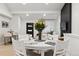 Elegant dining room features a beautifully set table and an open view into the living space at 12445 W 19Th Pl, Lakewood, CO 80215